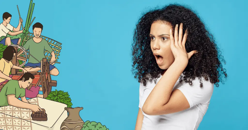 a woman covering her face with her hands while a cartoon of a family is on the wall behind her